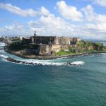 view of a castle and island on a Puerto Rico yacht charter