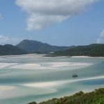 view of the Whitsundays with mountains and sand banks on a Whitsundays yacht charter