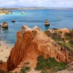 Portugal coastline with cliffs and golden sand on a Europe catamaran charter