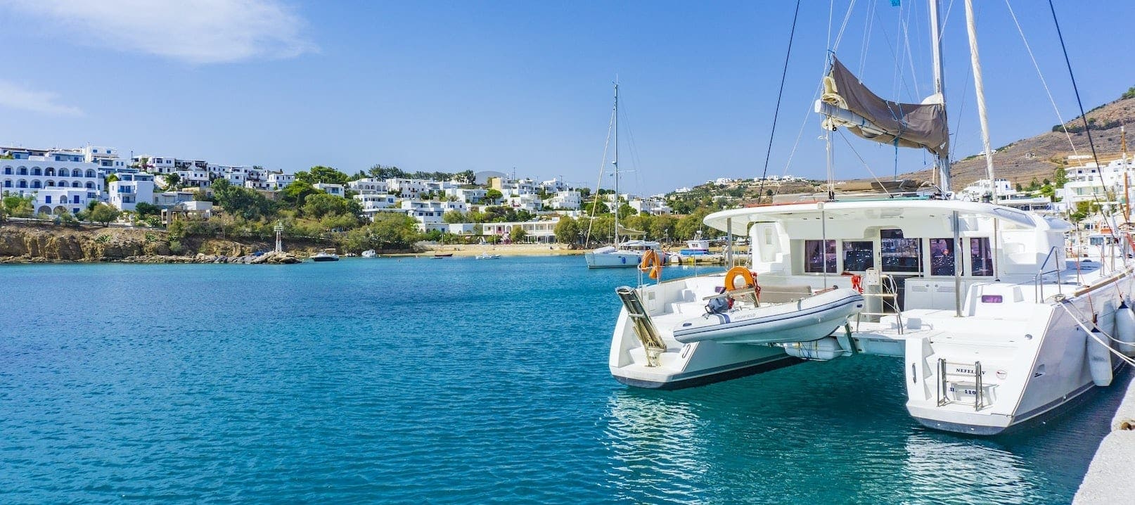 catamaran luxury yacht charter moored in a marina