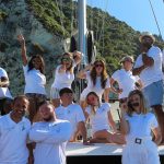 The SailChecker Team on the roof of a luxury charter catamaran
