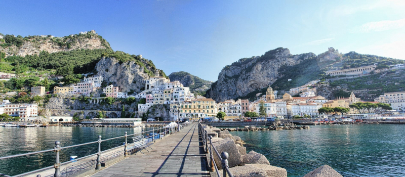 colorful houses and mountains on an amalfi coast sailing itinerary