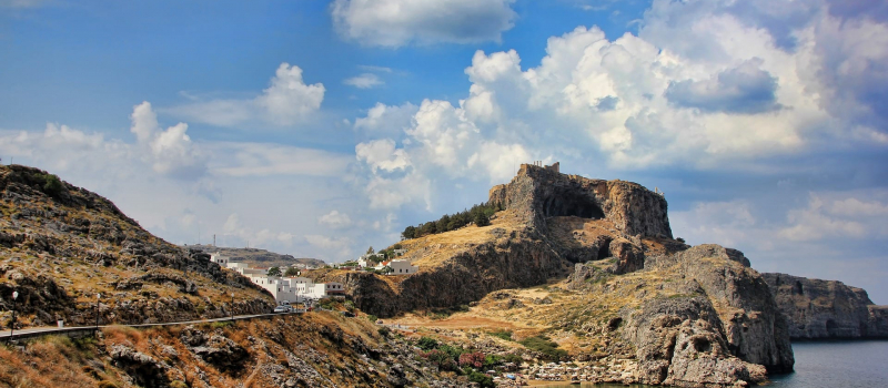 mountains and white houses on a Dodecanese sailing itinerary
