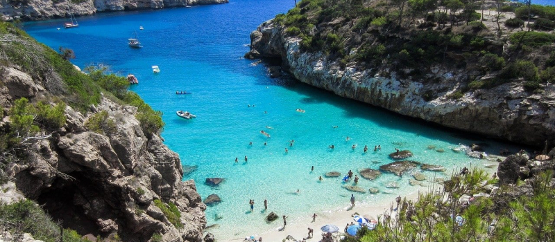cove with clear water on an ibiza sailing itinerary