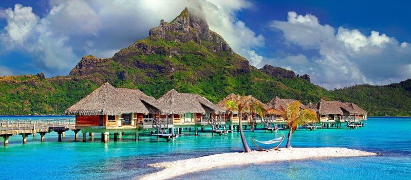 bungalows and clear water on a Tahiti sailing itinerary